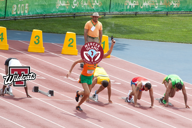 Still from The Dictator (2012) with Mercer Island and Toppenish school district logos imposed over the two characters' faces, used as a visual metaphor for the funding adequacy gap